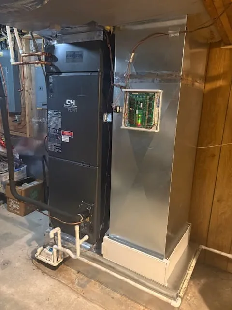 Ducted heat pump air handler installed in a basement mechanical room