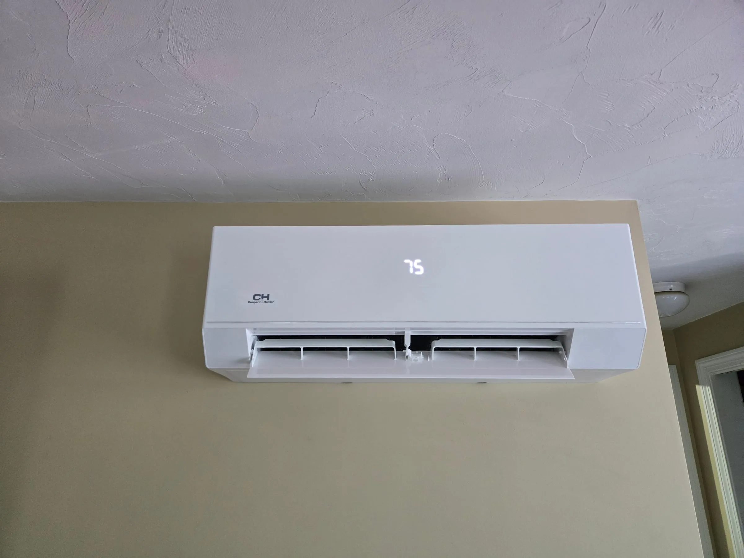 Wall-mounted ductless mini-split head installed in a home by Mann’s Heating & Air Conditioning