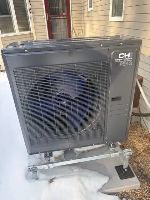 Outdoor condenser for a ducted heat pump system